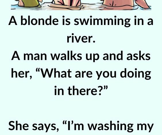 A Blonde Is Swimming In A River